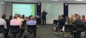 Colin presenting scaled 300x132 1