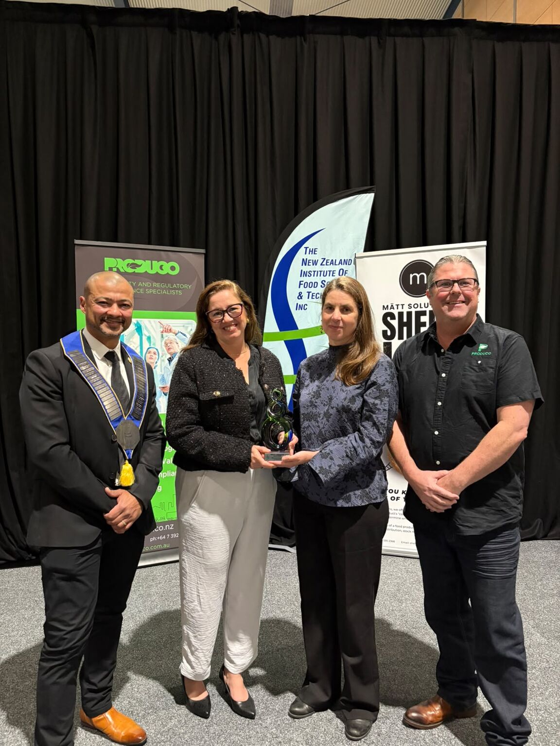 Representatives from Produco and AgResearch receiving the inaugural NZIFST Collaboration Award, recognising excellence in food safety, regulatory compliance and interdisciplinary research in New Zealand.
